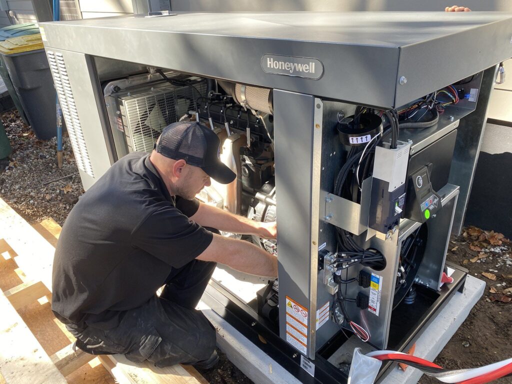 Technician working on a Honeywell generator.